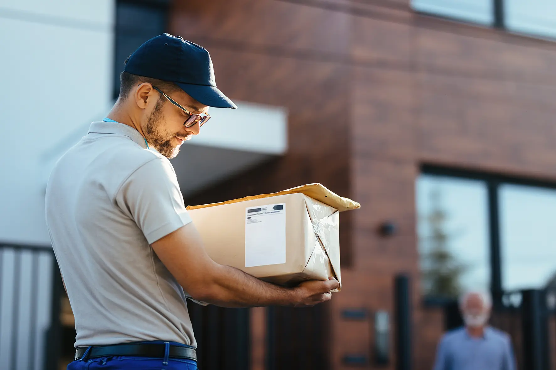 A delivery worker carrying a package