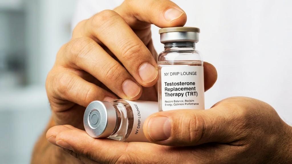 Hands holding testosterone replacement therapy vials